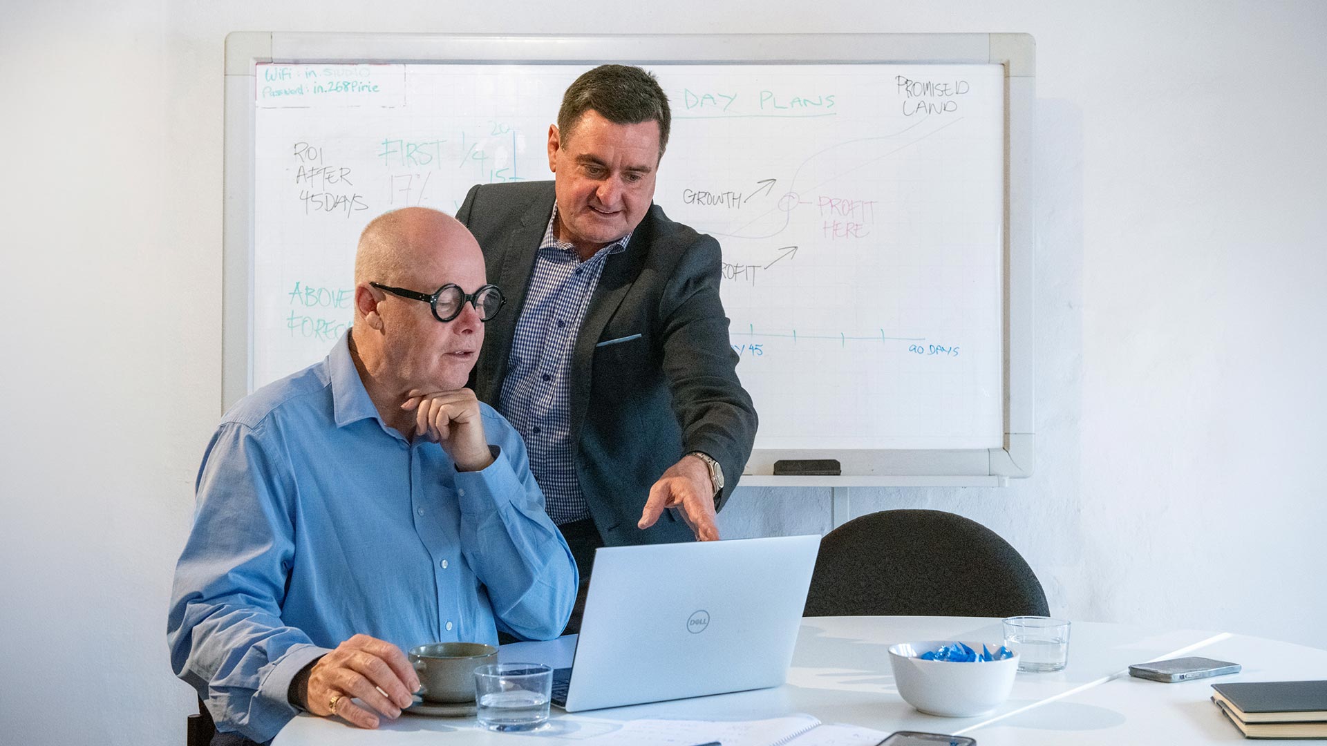 Kain Vodic from Marketing Catalyst Adelaide discussing strategy with client